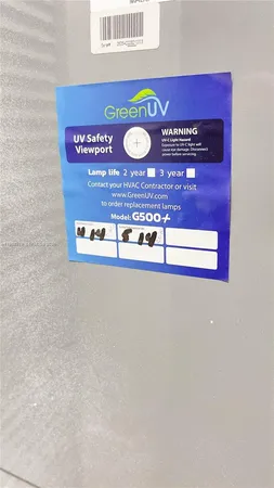 a view of a house with backyard and porch