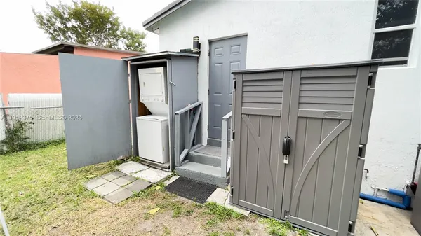 a view of a house with wooden deck