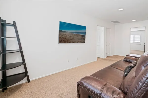 a bed room with furniture and a window