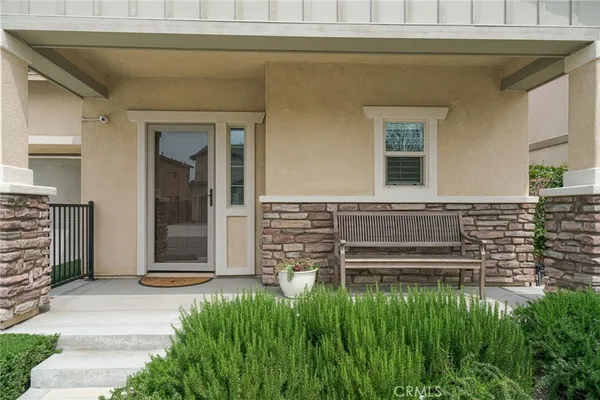 a view of front door of house with stairs
