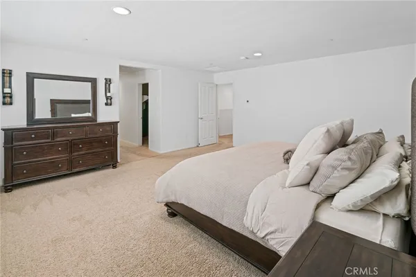a bathroom with a double vanity sink mirror and shower