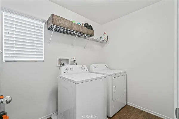 a bathroom with a toilet sink and a mirror