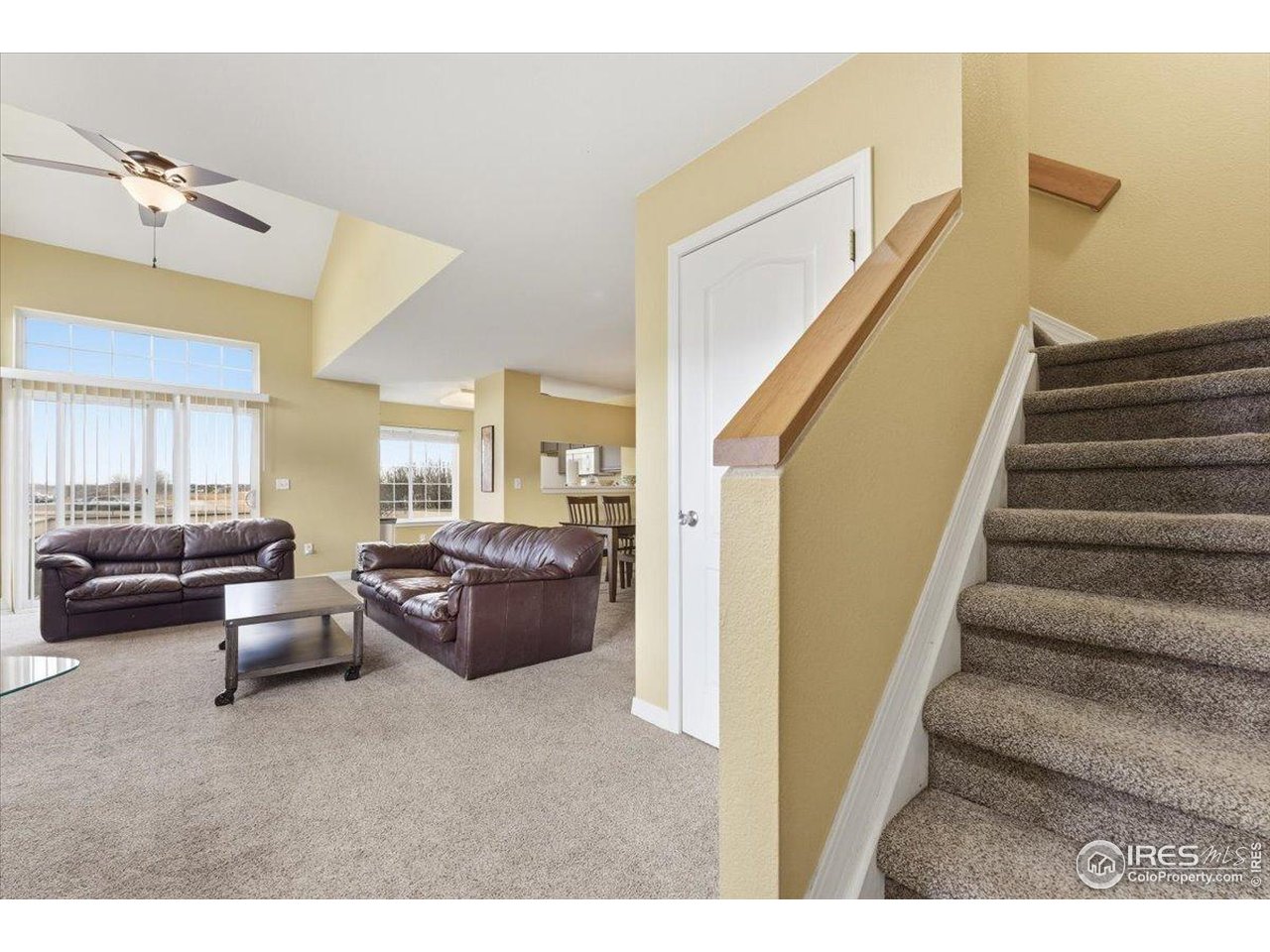 930 Button Rock Drive, Unit 64 Longmont, CO 80504 - Photo 13 of 23 a living room with furniture and a ceiling fan