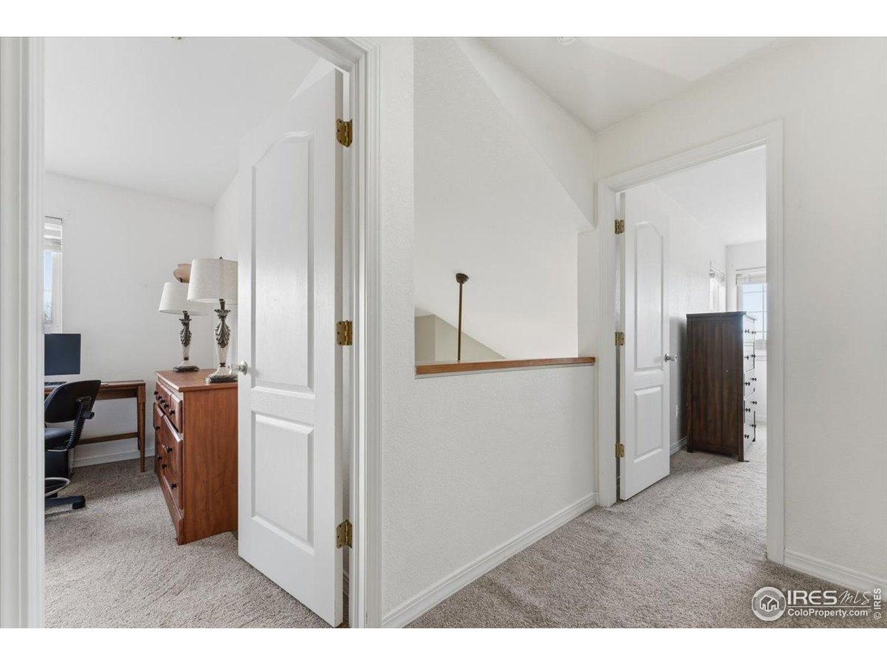 930 Button Rock Drive, Unit 64 Longmont, CO 80504 - Photo 14 of 23 a room with furniture and a wooden floor