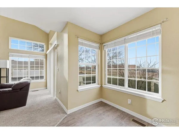 a living room with furniture and windows