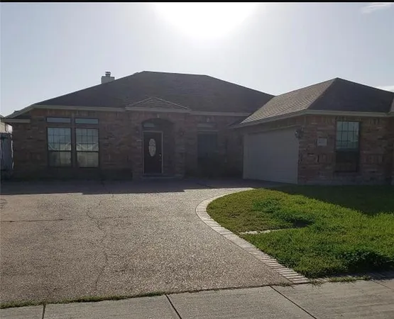 a house view with a garden space