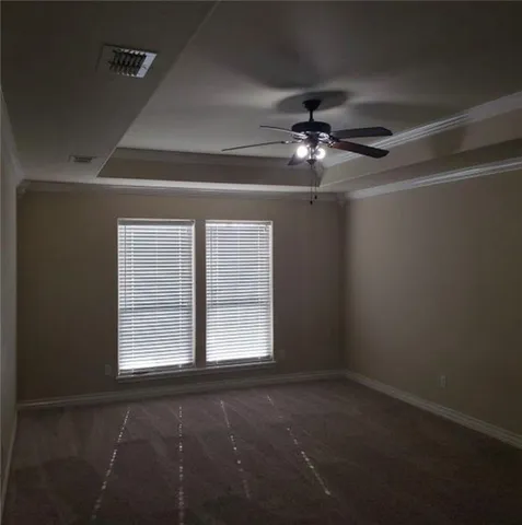 a view of empty room with windows