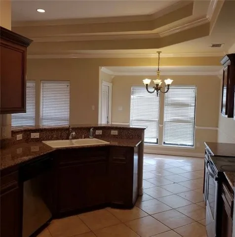 a kitchen with a sink and a refrigerator