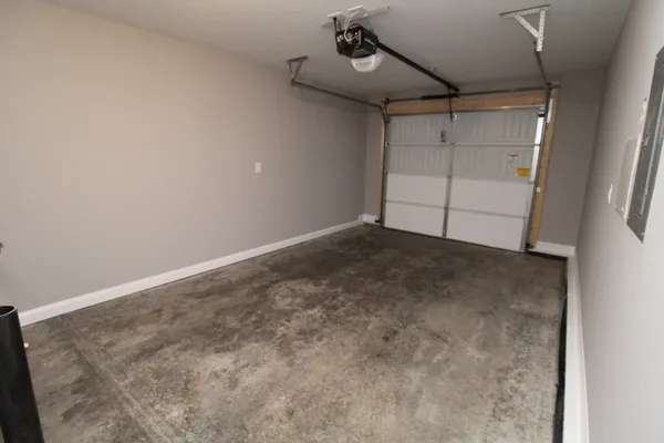 an empty room with a ceiling fan