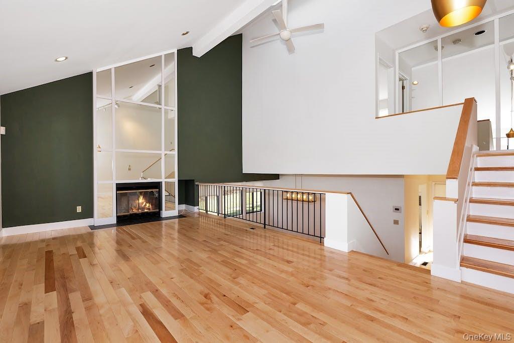 103 Rambling Brook Road Chappaqua, NY 10514 - Photo 12 of 33 a view of a hallway with wooden floor and floors