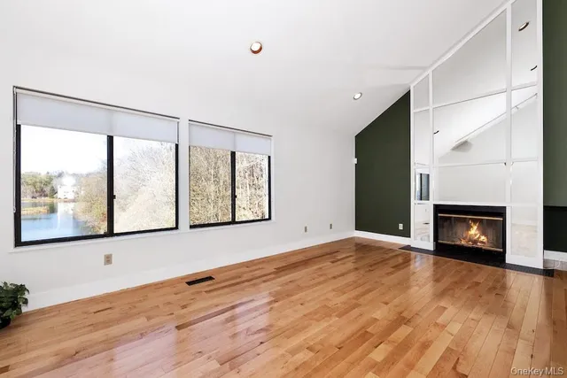 a view of an entryway with wooden floor