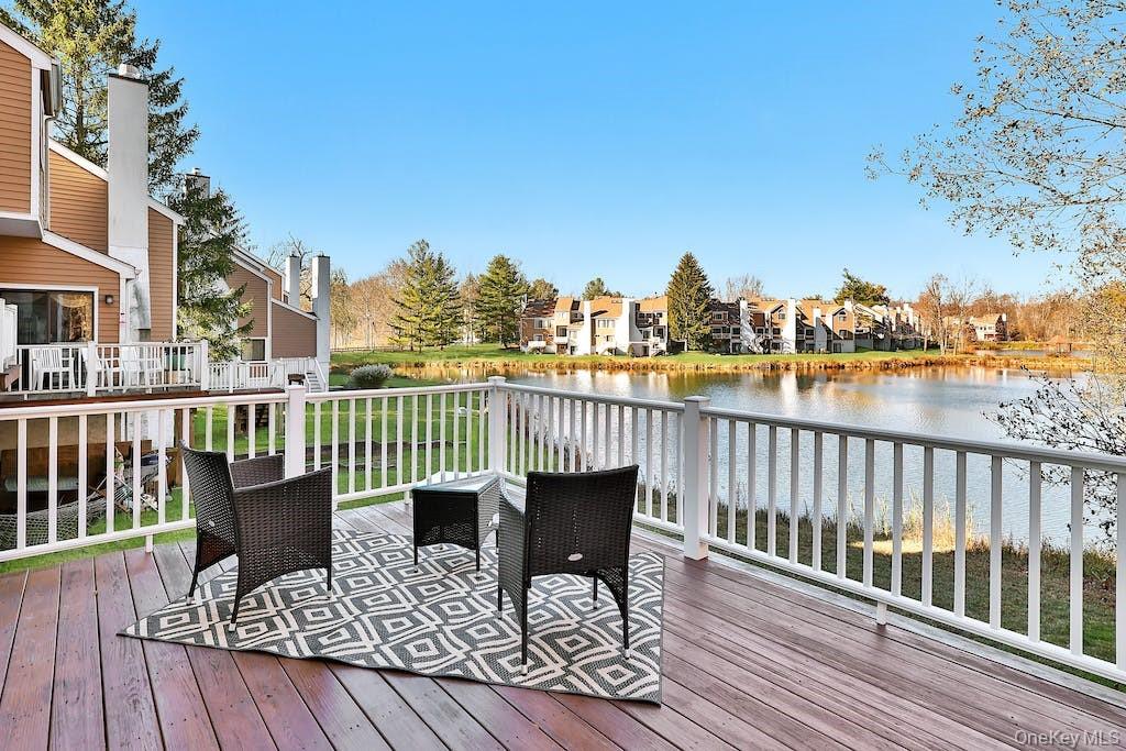 103 Rambling Brook Road Chappaqua, NY 10514 - Photo 20 of 33 a view of a balcony with wooden floor and outdoor seating