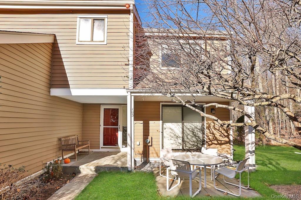 103 Rambling Brook Road Chappaqua, NY 10514 - Photo 2 of 33 a front view of a house with a yard