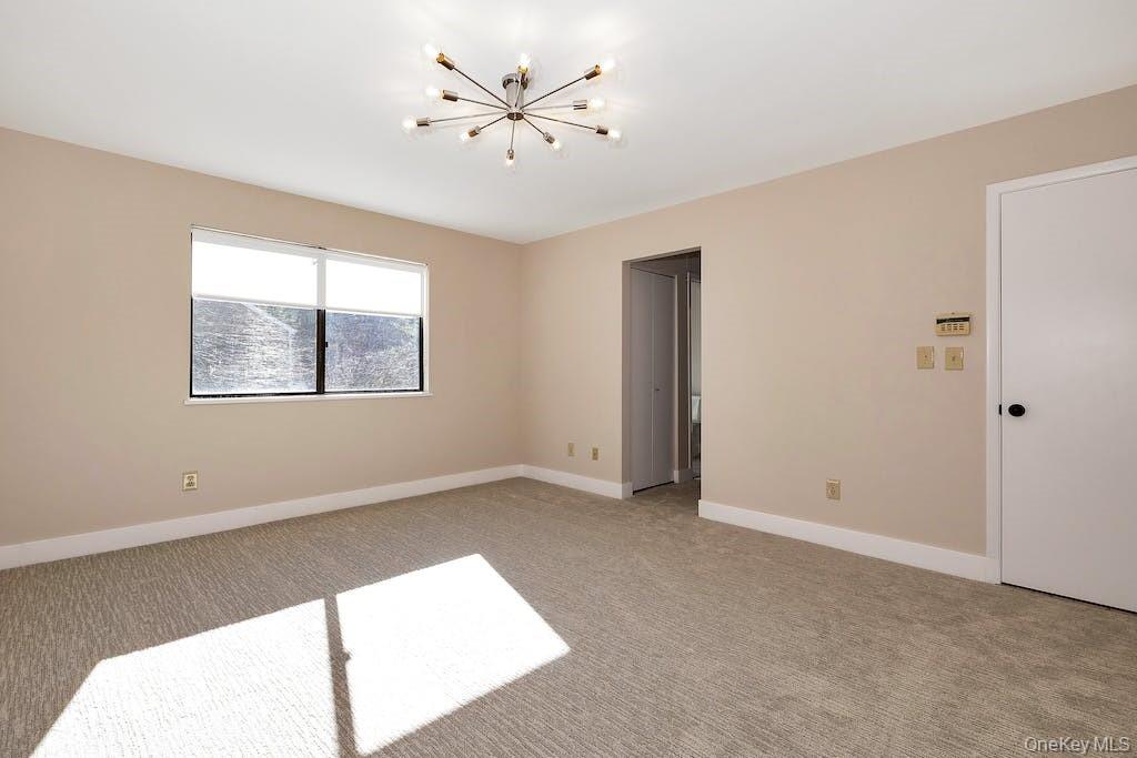 103 Rambling Brook Road Chappaqua, NY 10514 - Photo 22 of 33 a view of an empty room with a window