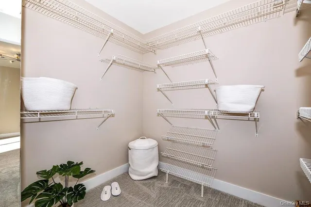 a bathroom with a granite countertop sink toilet and mirror
