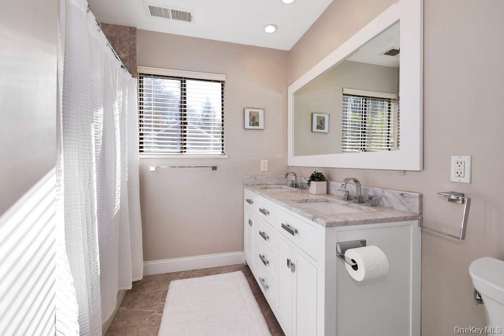 103 Rambling Brook Road Chappaqua, NY 10514 - Photo 24 of 33 a bathroom with a granite countertop sink toilet and mirror