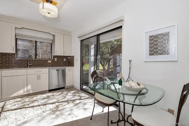 a kitchen with a refrigerator stove and cabinets