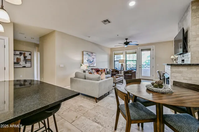 a view of a chairs and table in the patio
