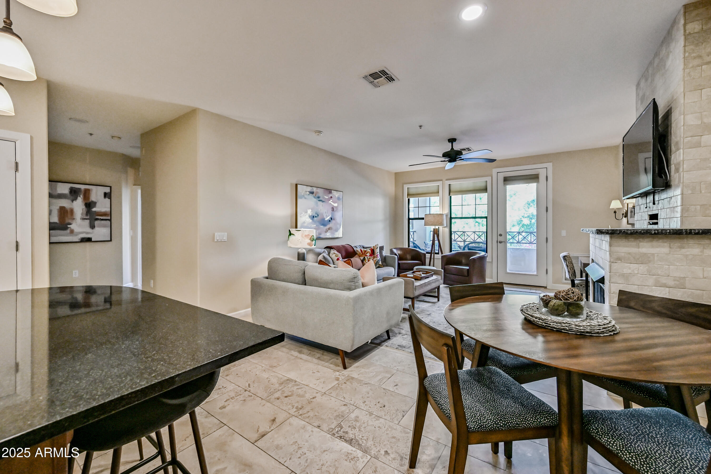 7291 North Scottsdale Road, Unit 2008 Paradise Valley, AZ 85253 - Photo 12 of 28 a living room with dining table and kitchen view