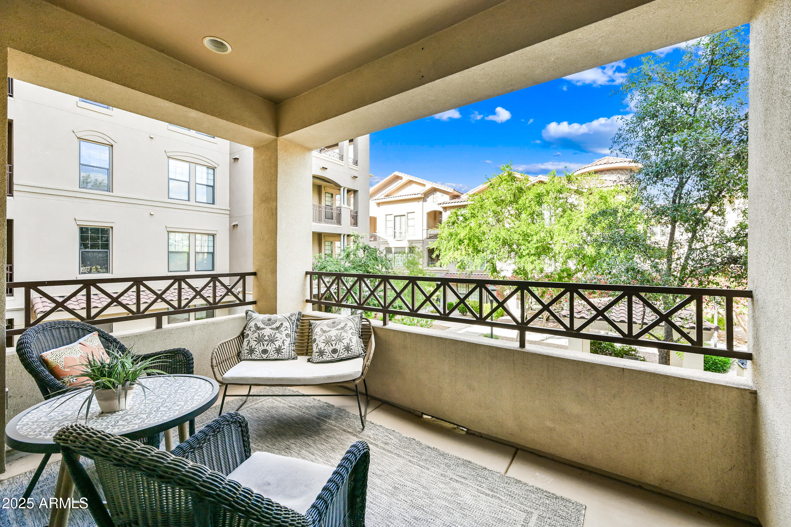 7291 North Scottsdale Road, Unit 2008 Paradise Valley, AZ 85253 - Photo 13 of 28 a view of a chairs and table in the patio
