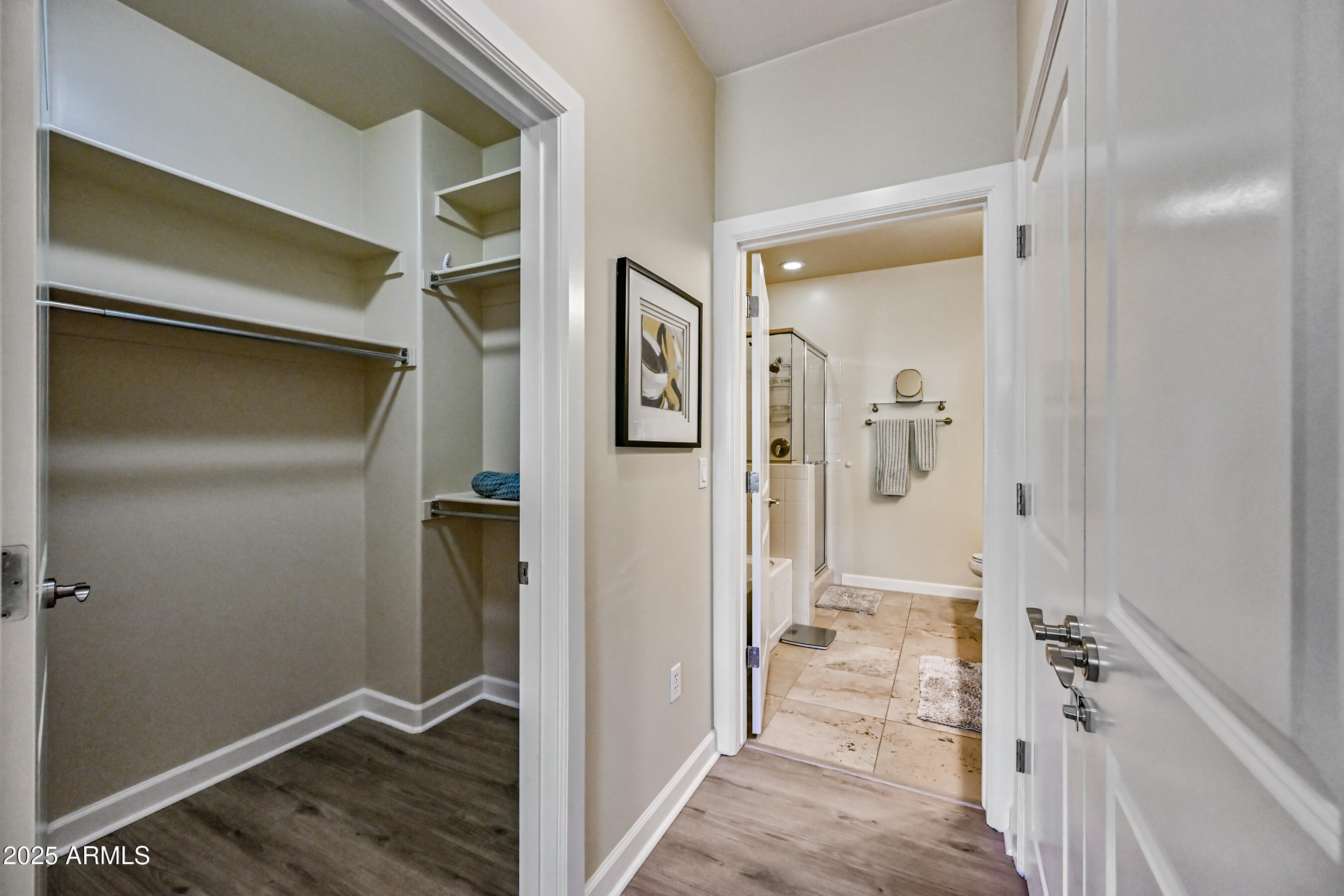 7291 North Scottsdale Road, Unit 2008 Paradise Valley, AZ 85253 - Photo 17 of 28 a view of a hallway with wooden floor and closet