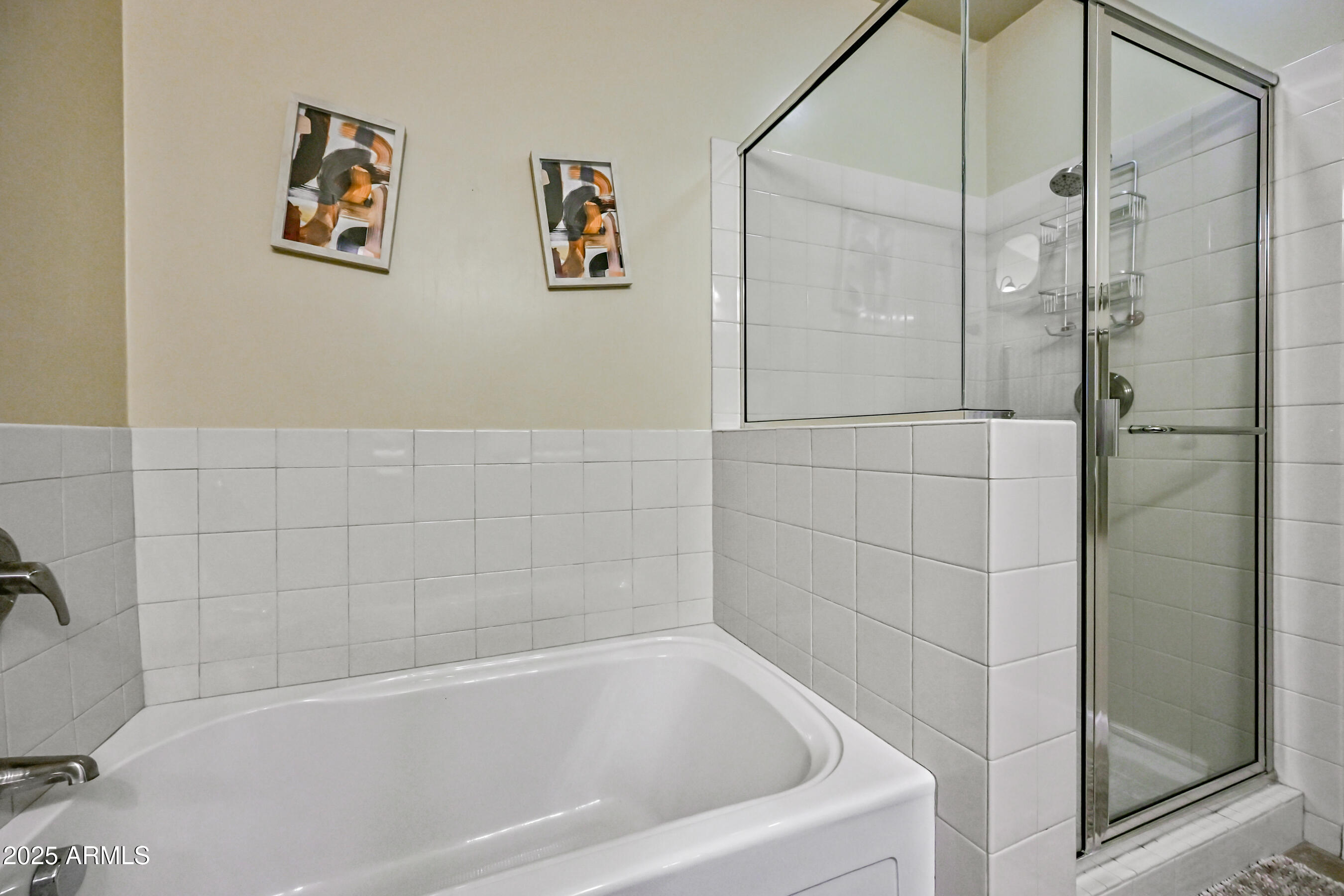 7291 North Scottsdale Road, Unit 2008 Paradise Valley, AZ 85253 - Photo 19 of 28 a bathroom with a bathtub and a shower