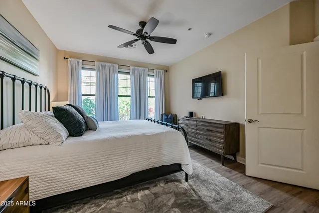 a bedroom with a bed and a window