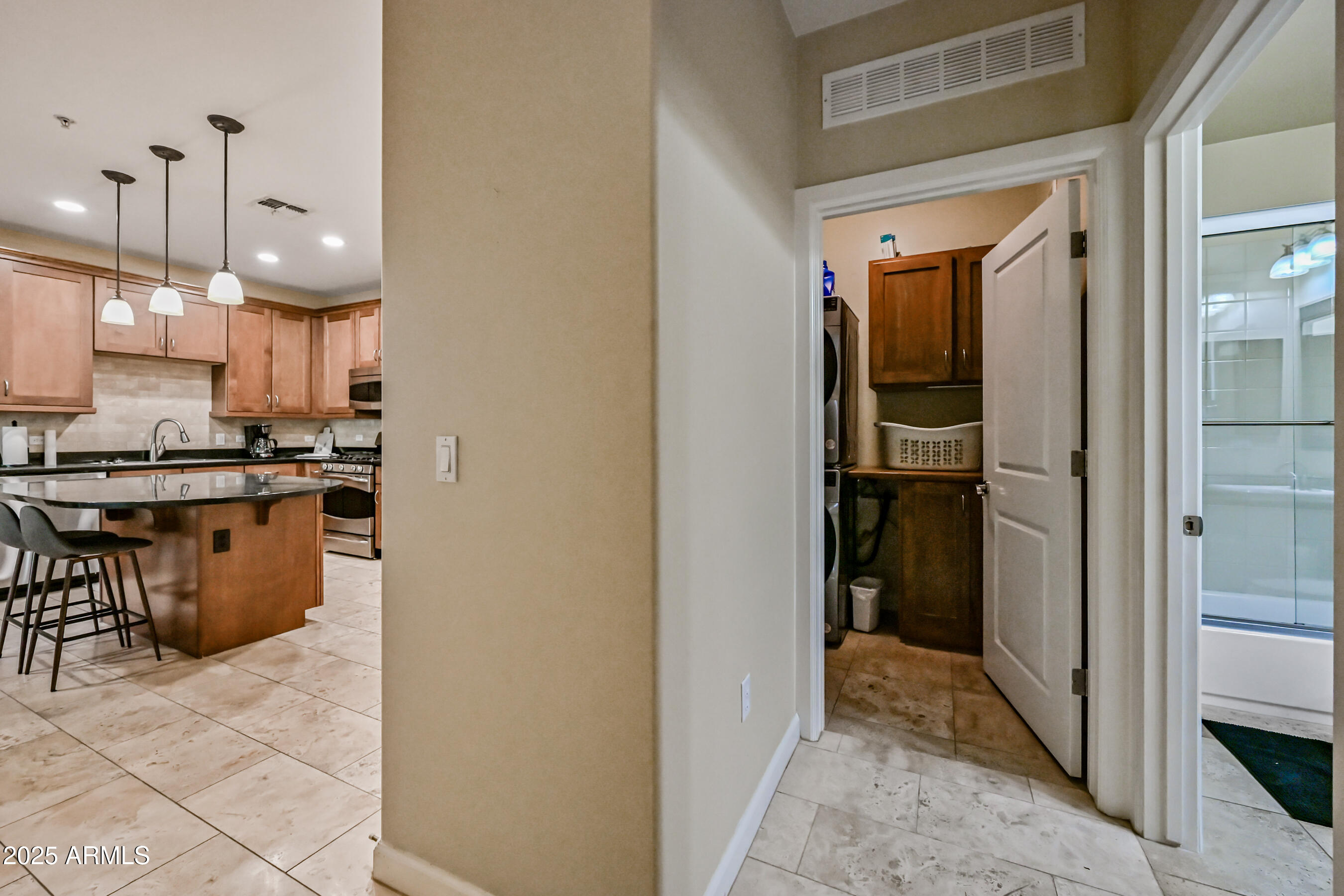 7291 North Scottsdale Road, Unit 2008 Paradise Valley, AZ 85253 - Photo 23 of 28 a kitchen with stainless steel appliances granite countertop a refrigerator and a sink