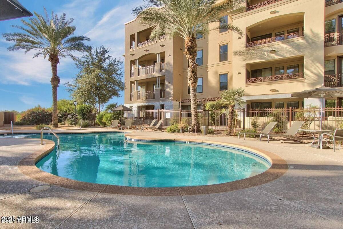 7291 North Scottsdale Road, Unit 2008 Paradise Valley, AZ 85253 - Photo 27 of 28 a view of a swimming pool with outdoor seating