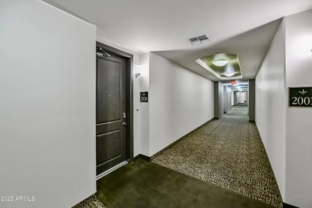 a large kitchen with kitchen island granite countertop a stove a sink and a refrigerator