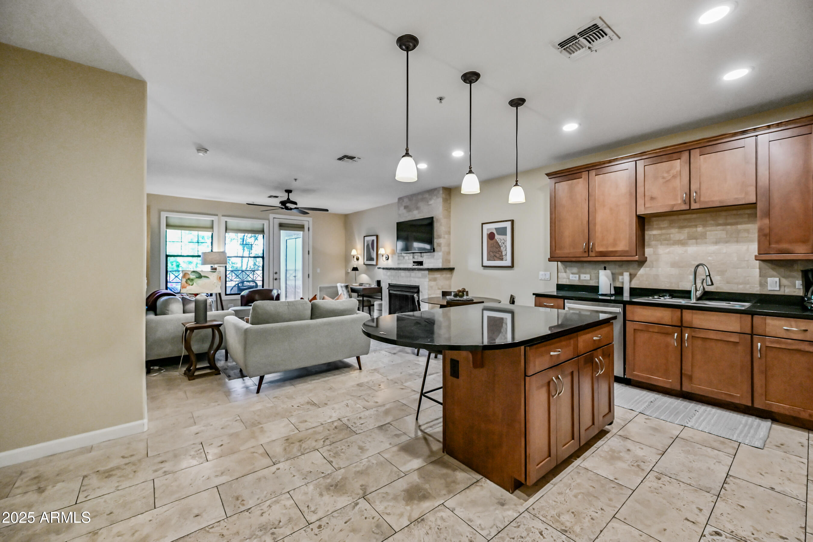 7291 North Scottsdale Road, Unit 2008 Paradise Valley, AZ 85253 - Photo 4 of 28 a large kitchen with kitchen island granite countertop a stove a sink and a refrigerator