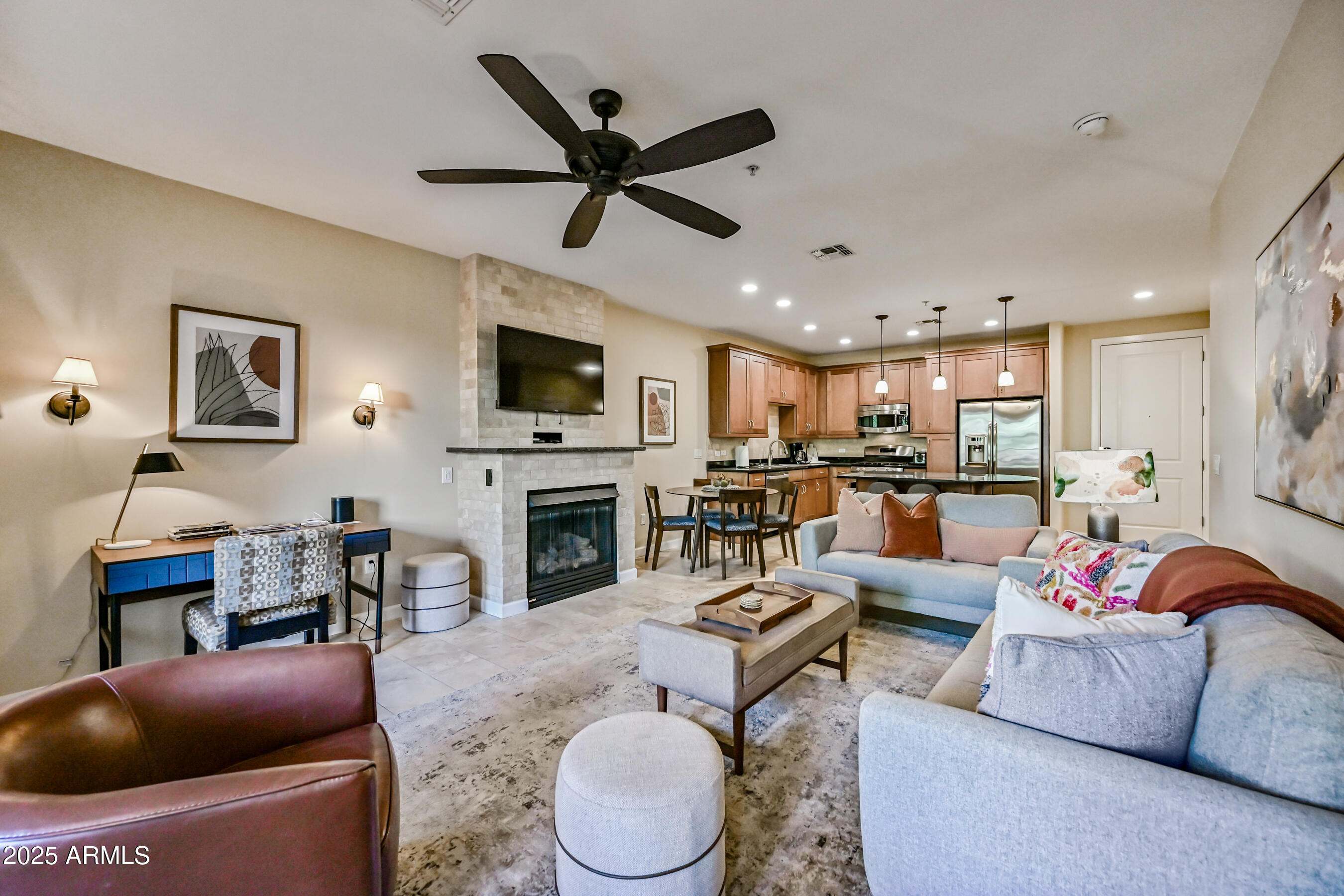 7291 North Scottsdale Road, Unit 2008 Paradise Valley, AZ 85253 - Photo 7 of 28 a living room with furniture a fireplace and a flat screen tv