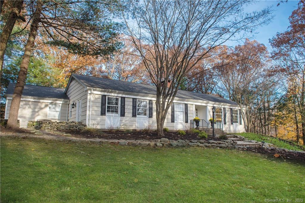 48 Nod Road Ridgefield, CT 06877 - Photo 1 of 1 a front view of a house with a garden