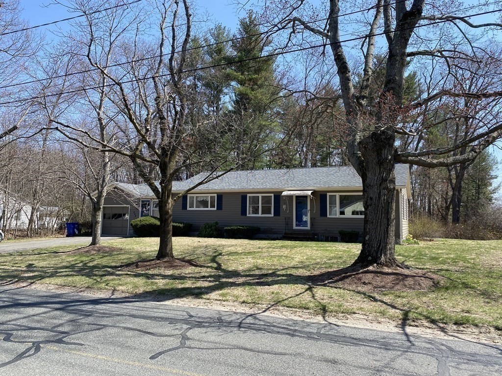 230 Straits Road Hatfield, MA 01038 - Photo 1 of 23 a front view of a house with a yard covered with trees