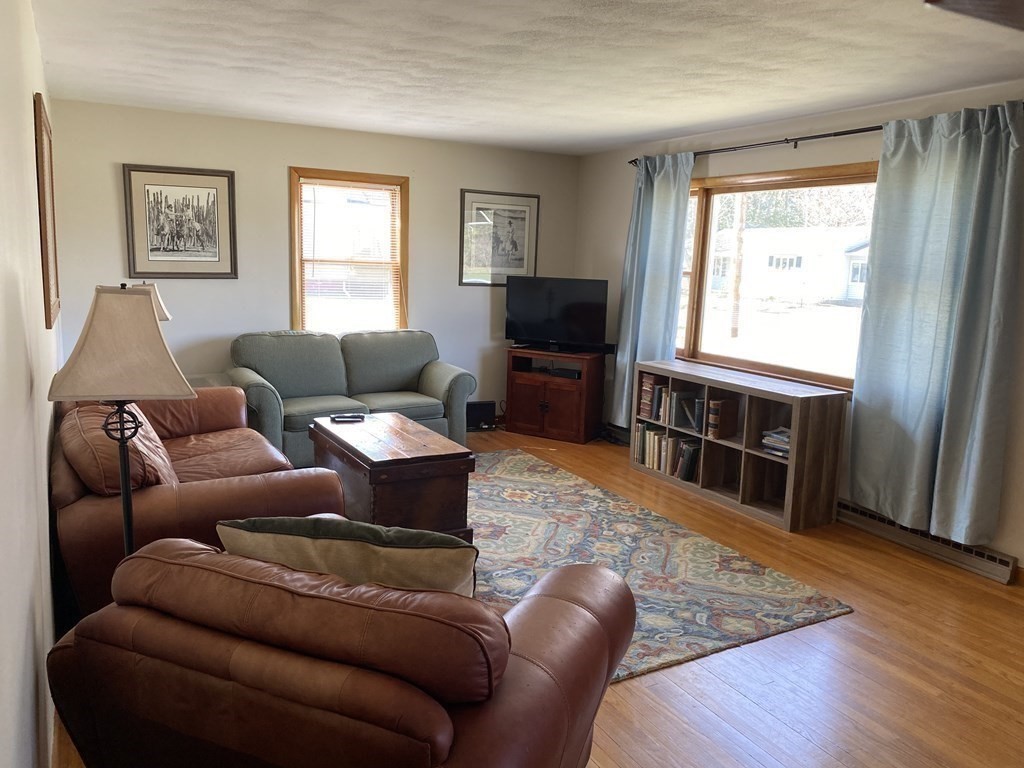 230 Straits Road Hatfield, MA 01038 - Photo 11 of 23 a living room with furniture and a flat screen tv