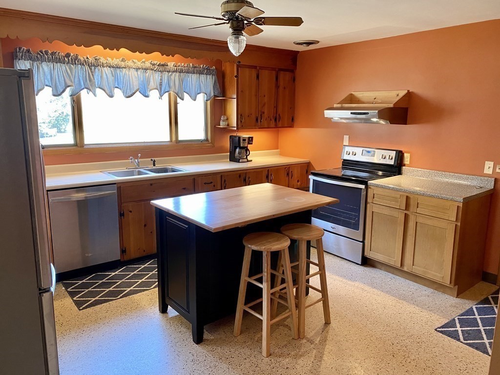 230 Straits Road Hatfield, MA 01038 - Photo 4 of 23 a kitchen with a stove a sink and a refrigerator