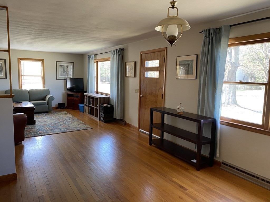 230 Straits Road Hatfield, MA 01038 - Photo 7 of 23 a living room with wooden floors and furniture