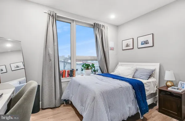 a bed room with a bed and a couch