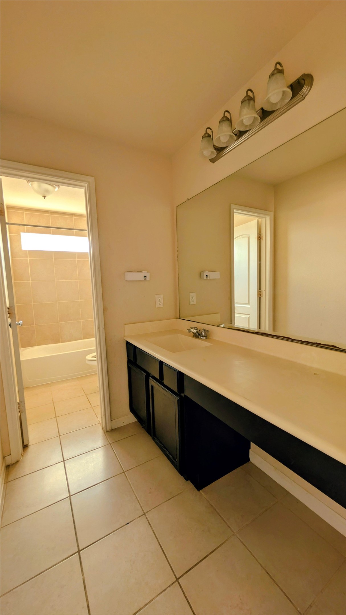 7326 Granite Terrace Lane Houston, TX 77083 - Photo 26 of 39 a large bathroom with a sink and a mirror