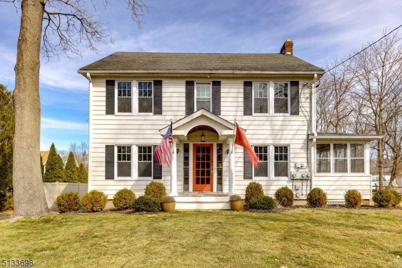 a front view of a house with a swimming pool