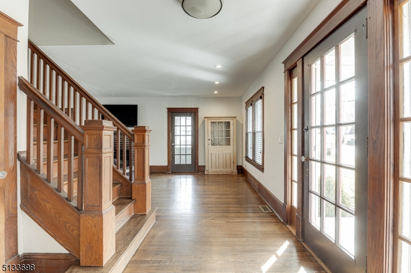 11 Village Road New Vernon, NJ 07976 - Photo 2 of 26 a view of an entryway with wooden floor and windows