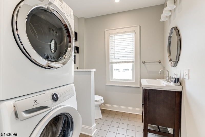 11 Village Road New Vernon, NJ 07976 - Photo 21 of 26 a bathroom with a sink and a mirror
