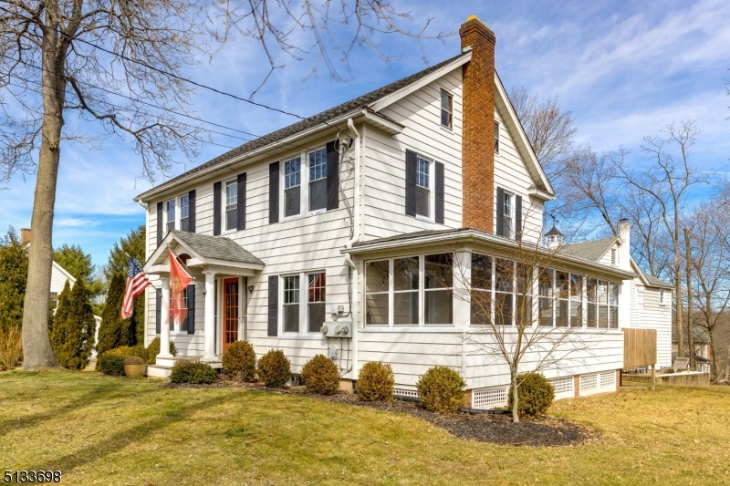 11 Village Road New Vernon, NJ 07976 - Photo 26 of 26 a front view of a house with a yard outdoor seating and garage
