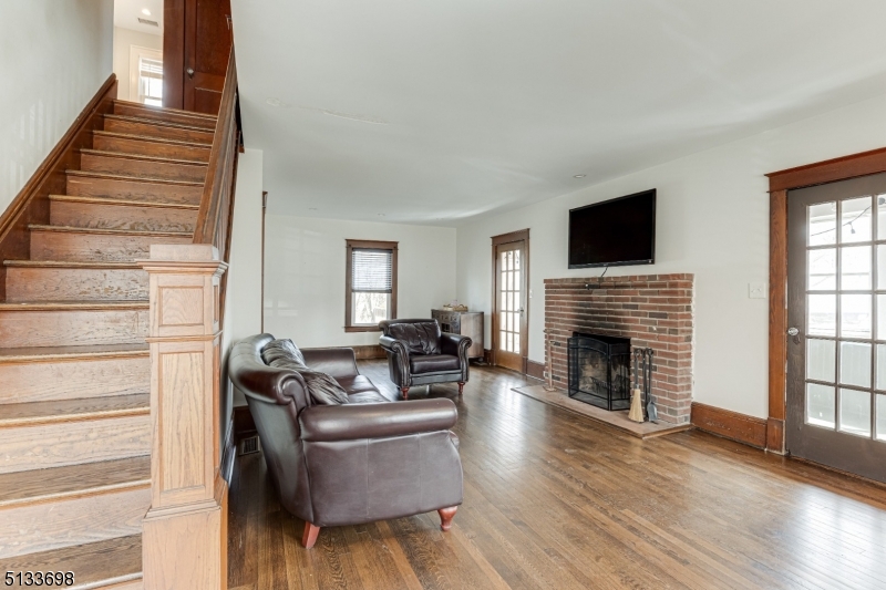 11 Village Road New Vernon, NJ 07976 - Photo 3 of 26 a living room with furniture and a fireplace