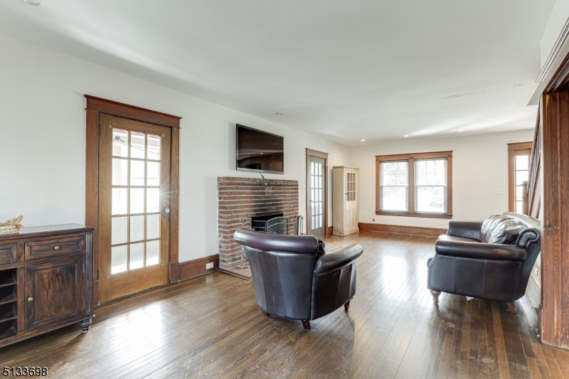 11 Village Road New Vernon, NJ 07976 - Photo 5 of 26 a living room with furniture and a flat screen tv