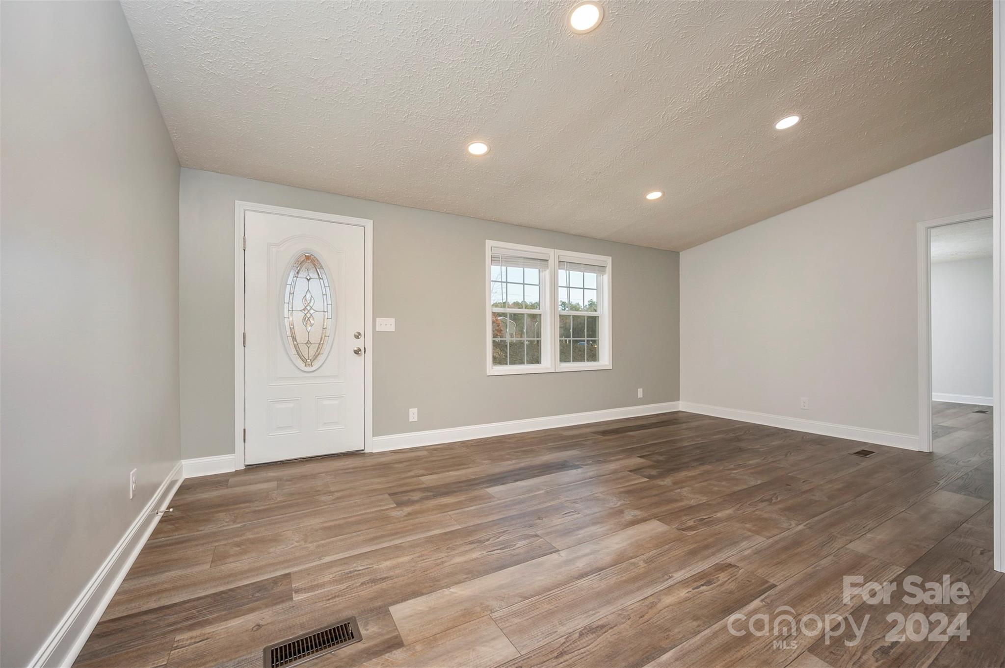 163 Mountain Creek Road Rutherfordton, NC 28139 - Photo 14 of 35 a view of empty room with wooden floor and window
