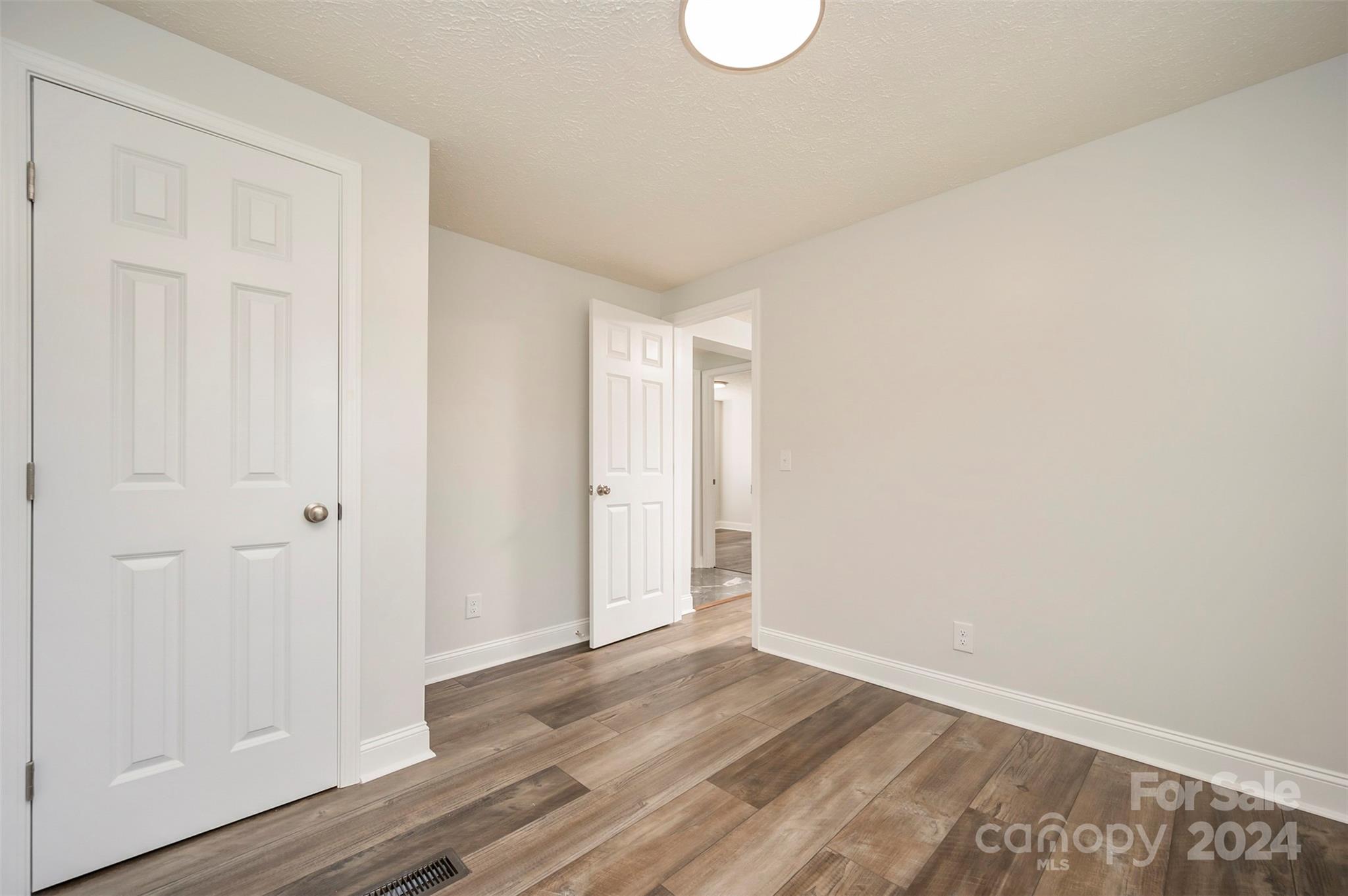 163 Mountain Creek Road Rutherfordton, NC 28139 - Photo 27 of 35 a view of an empty room and wooden floor