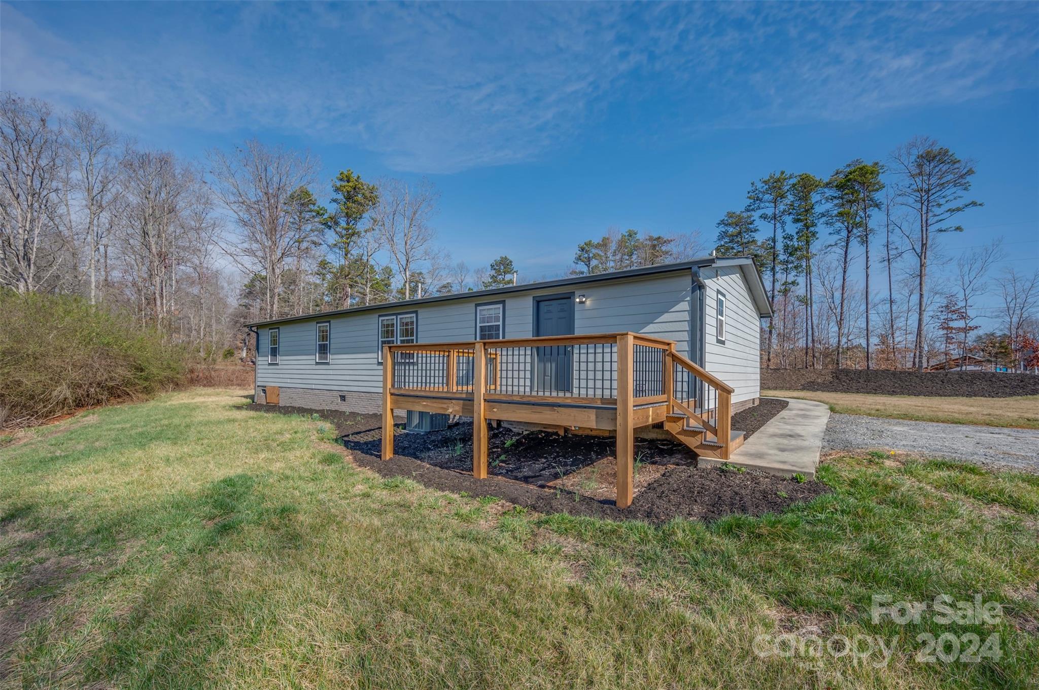 163 Mountain Creek Road Rutherfordton, NC 28139 - Photo 4 of 35 a backyard of a house with table and chairs