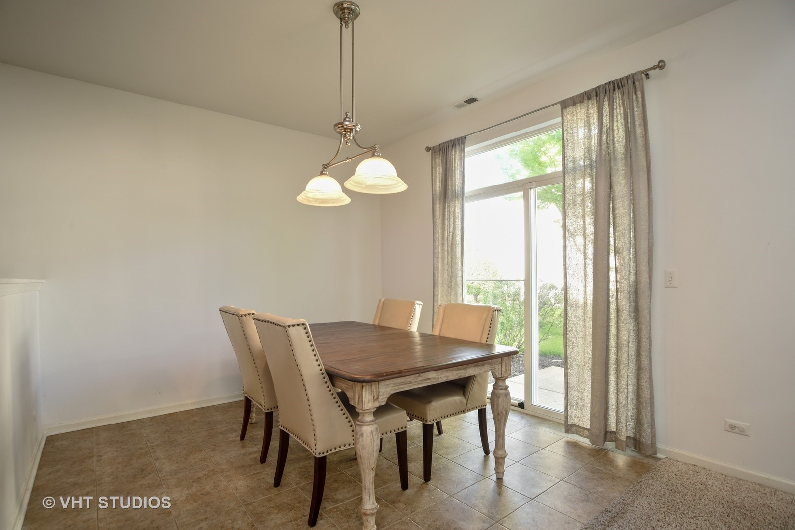 2946 Falling Waters Lane Lindenhurst, IL 60046 - Photo 4 of 10 a view of a dining room with furniture window and outside view