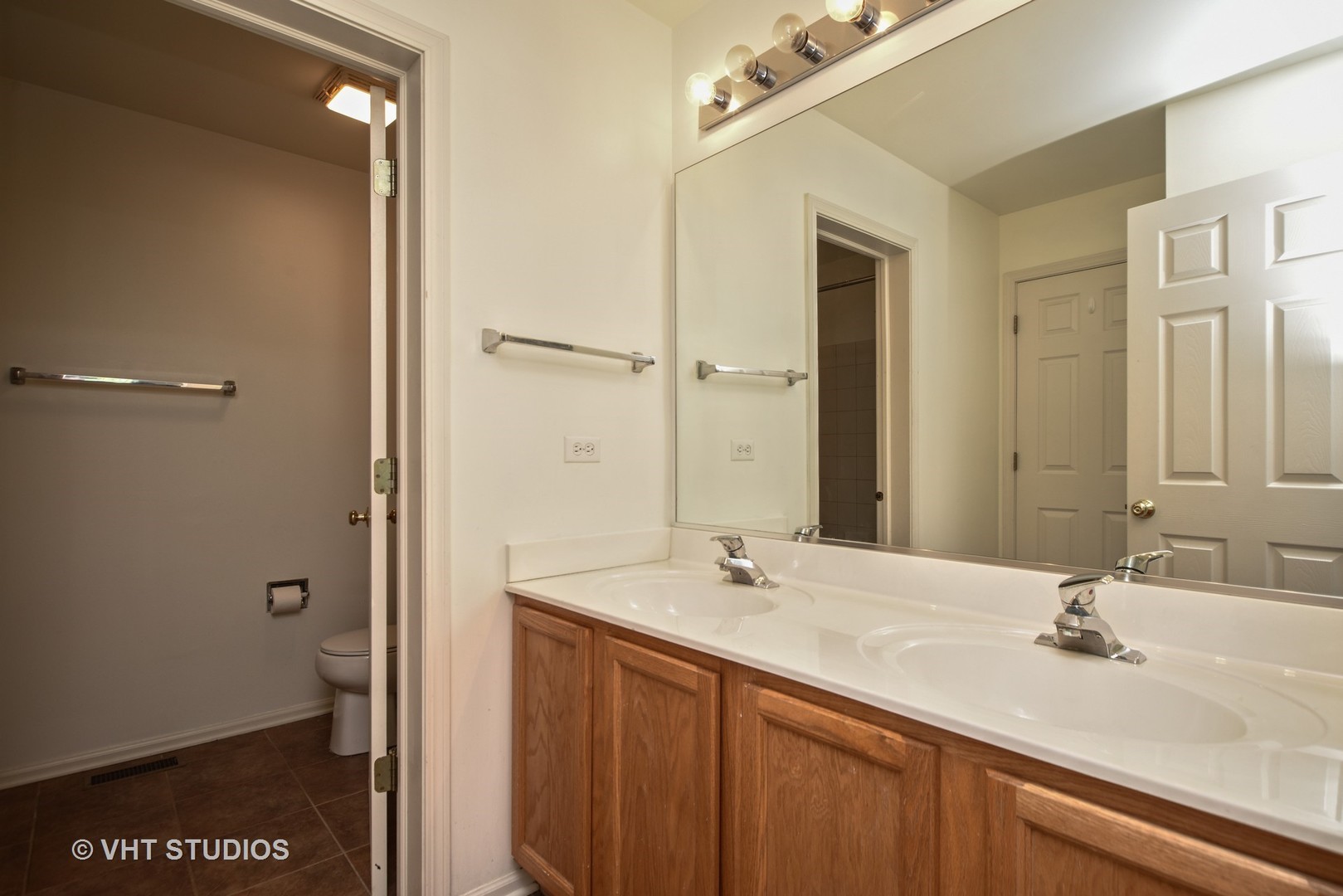 2946 Falling Waters Lane Lindenhurst, IL 60046 - Photo 9 of 10 a bathroom with a sink and a mirror